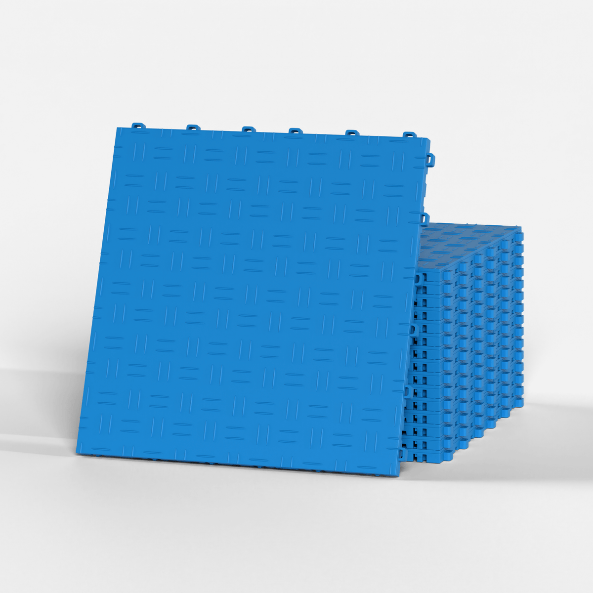 ULTRATUFF garage floor tile in Riviera Blue, standing in front of a stack
