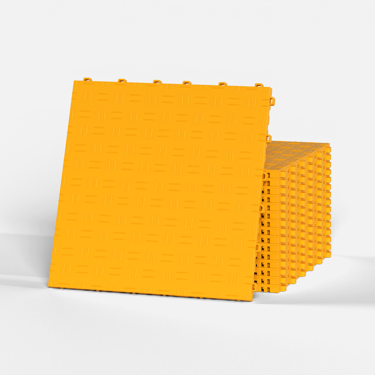 ULTRATUFF garage floor tile in Speed Yellow, standing in front of a stack