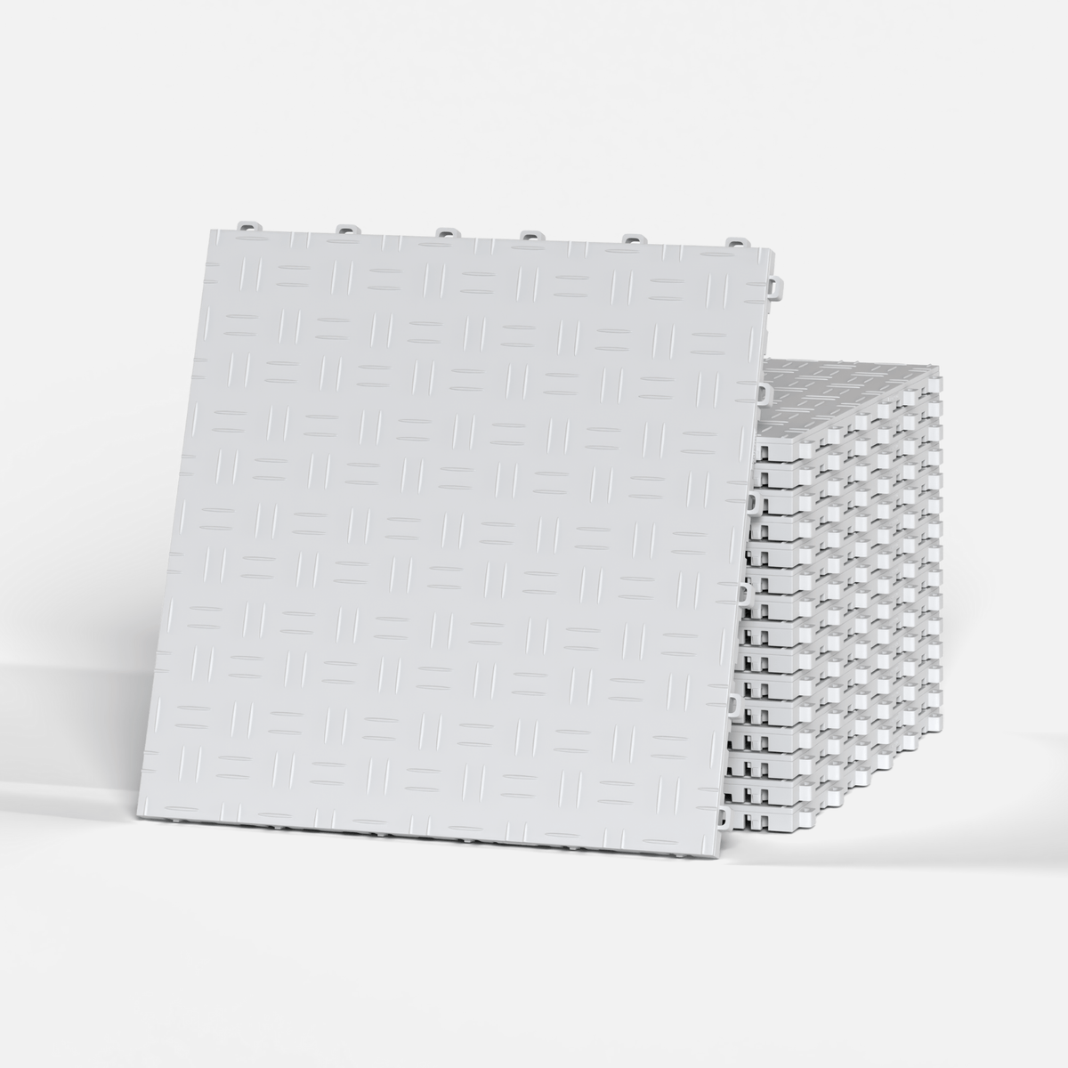 ULTRATUFF garage floor tile in Glacier Grey, standing in front of a stack