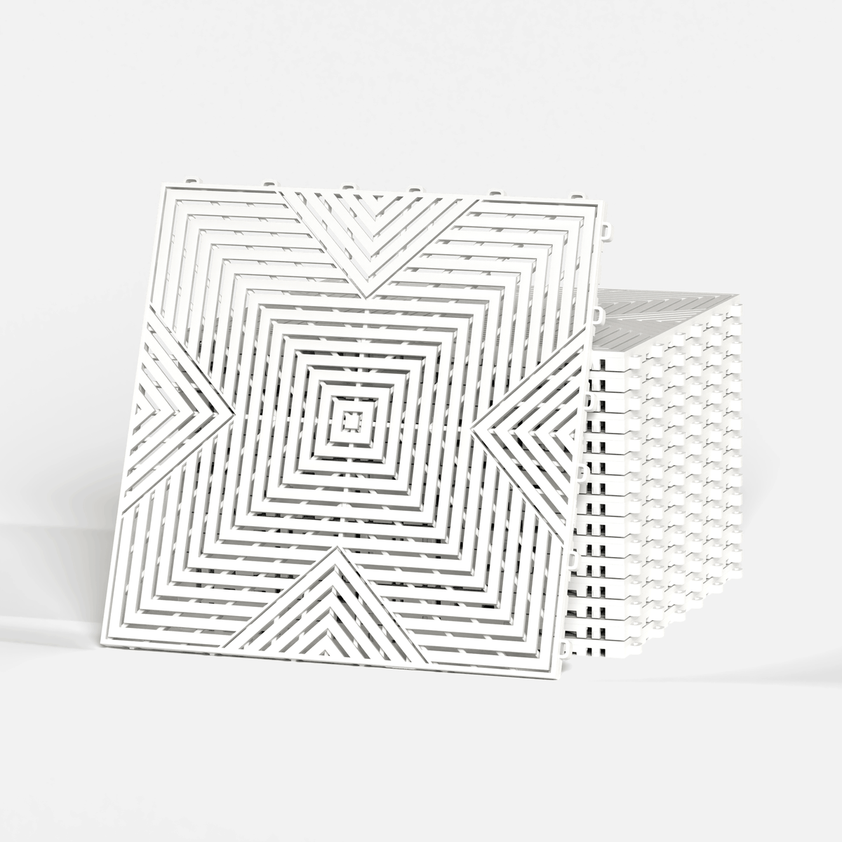 ULTRACORE garage floor tile in Alpine White, standing in front of a stack