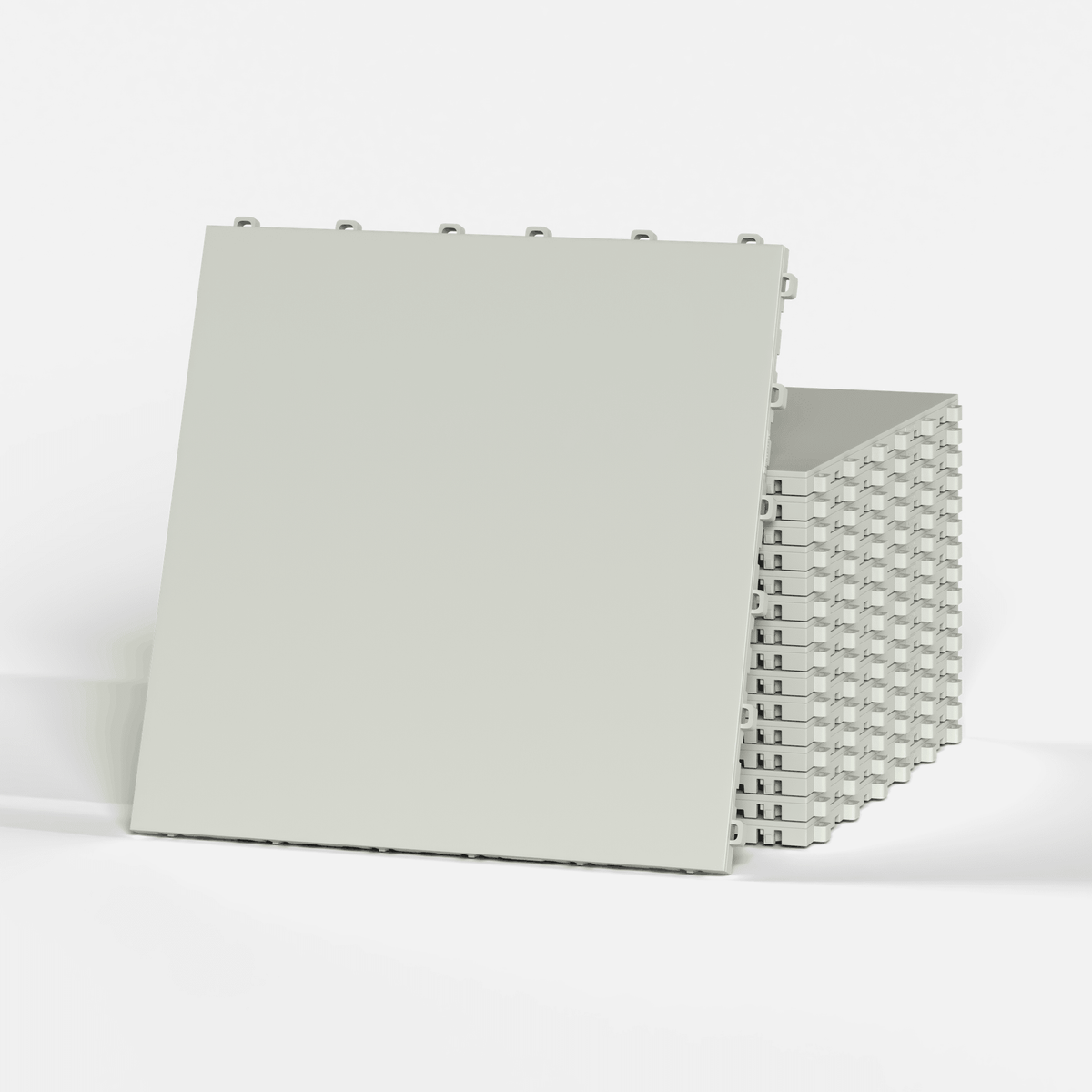 ULTRATONE modular floor tile in Coastal Grey, a stack of tiles