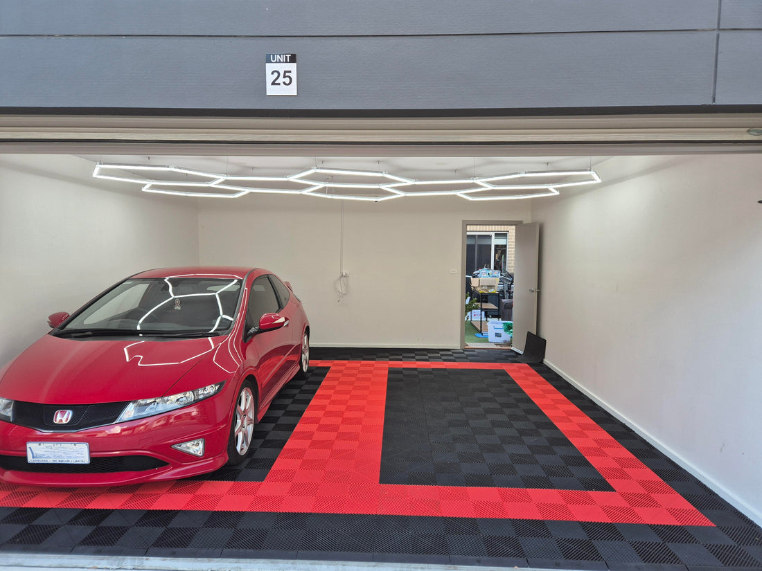 Man cave garage with Sleek Space floor tiles and vehicle