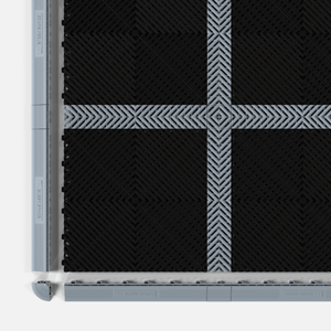 CORDLINK cable management in Silver Grey, set into a tile floor beside its edge ramps