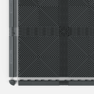 EXTENDER Strips in Space Grey in an ULTRAGRID® floor with the edge ramps lifted away
