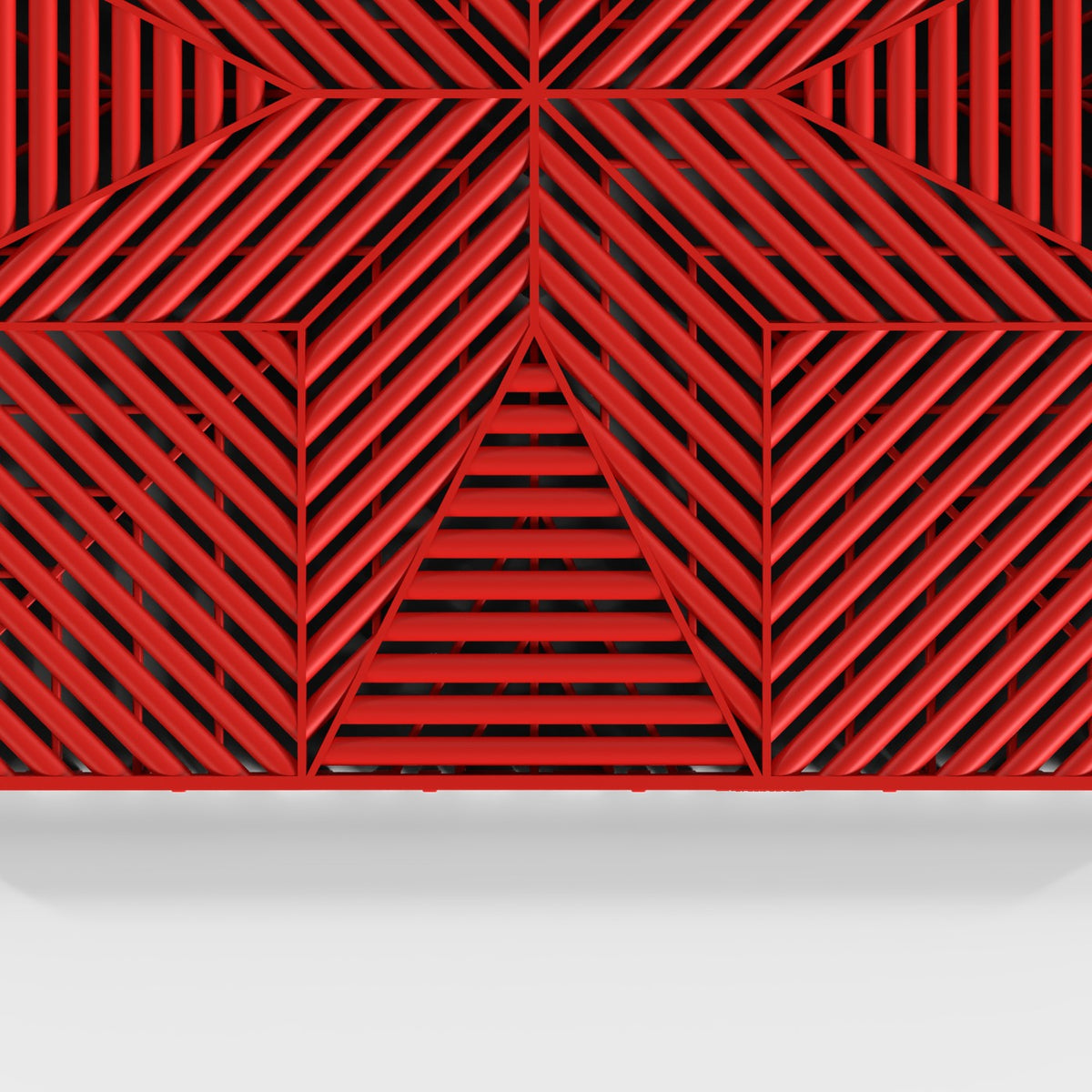 ULTRAFLUX tile in Rosso Red: the star-pattern face from above