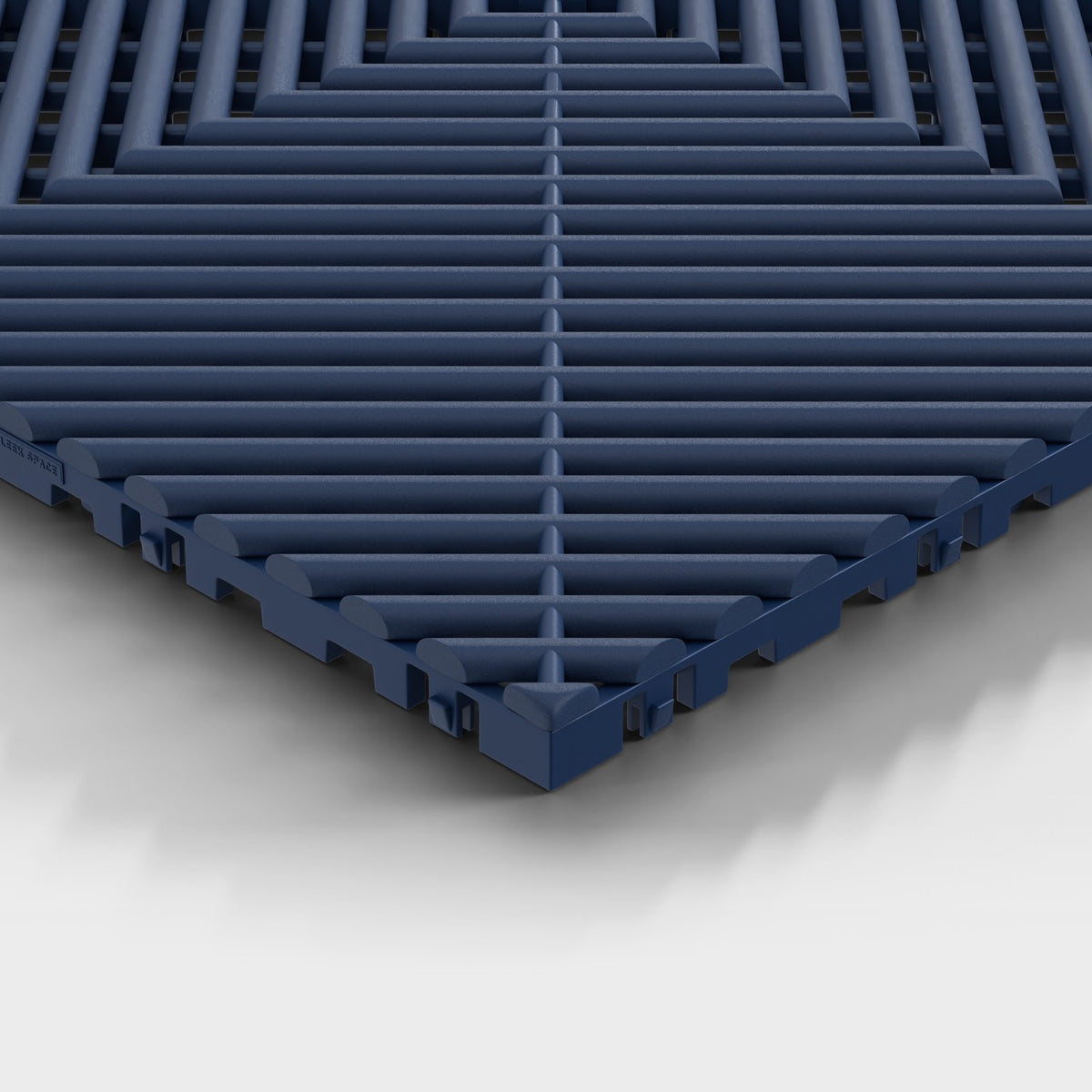 ULTRAGRID tile in Night Blue: one corner seen low, the open ribs and the legs under them