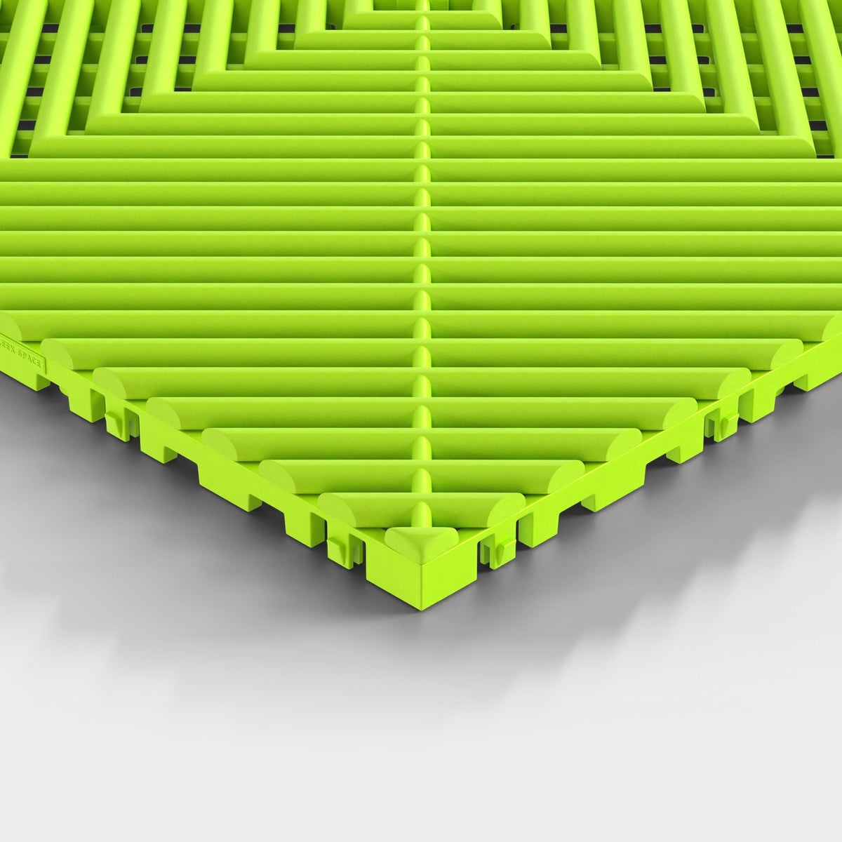 ULTRAGRID tile in Electric Green: one corner seen low, the open ribs and the legs under them