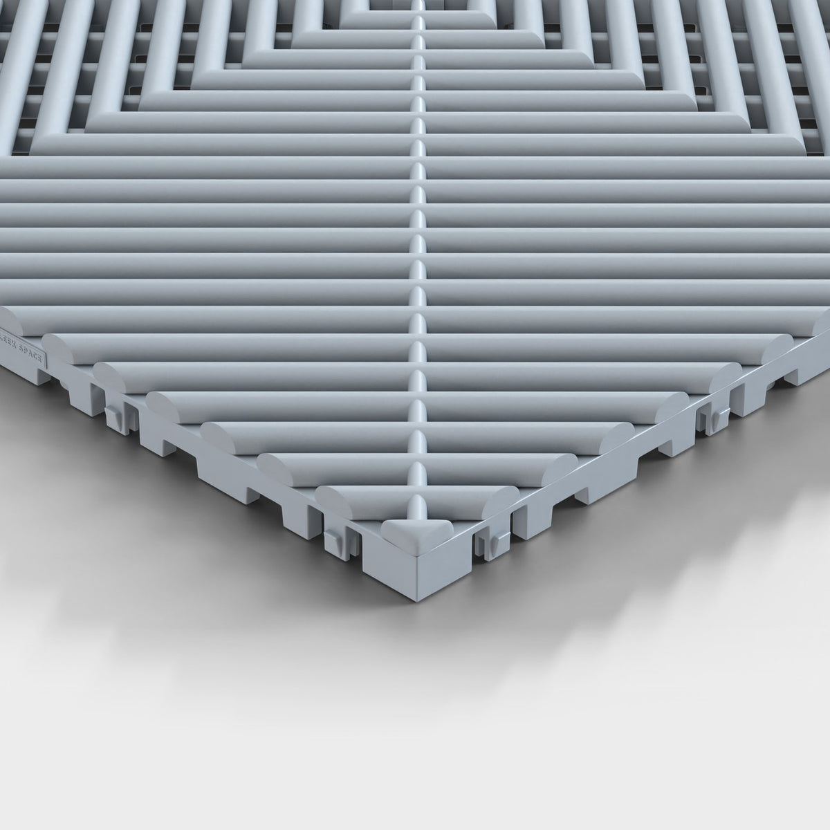ULTRAGRID tile in Silver Grey: one corner seen low, the open ribs and the legs under them