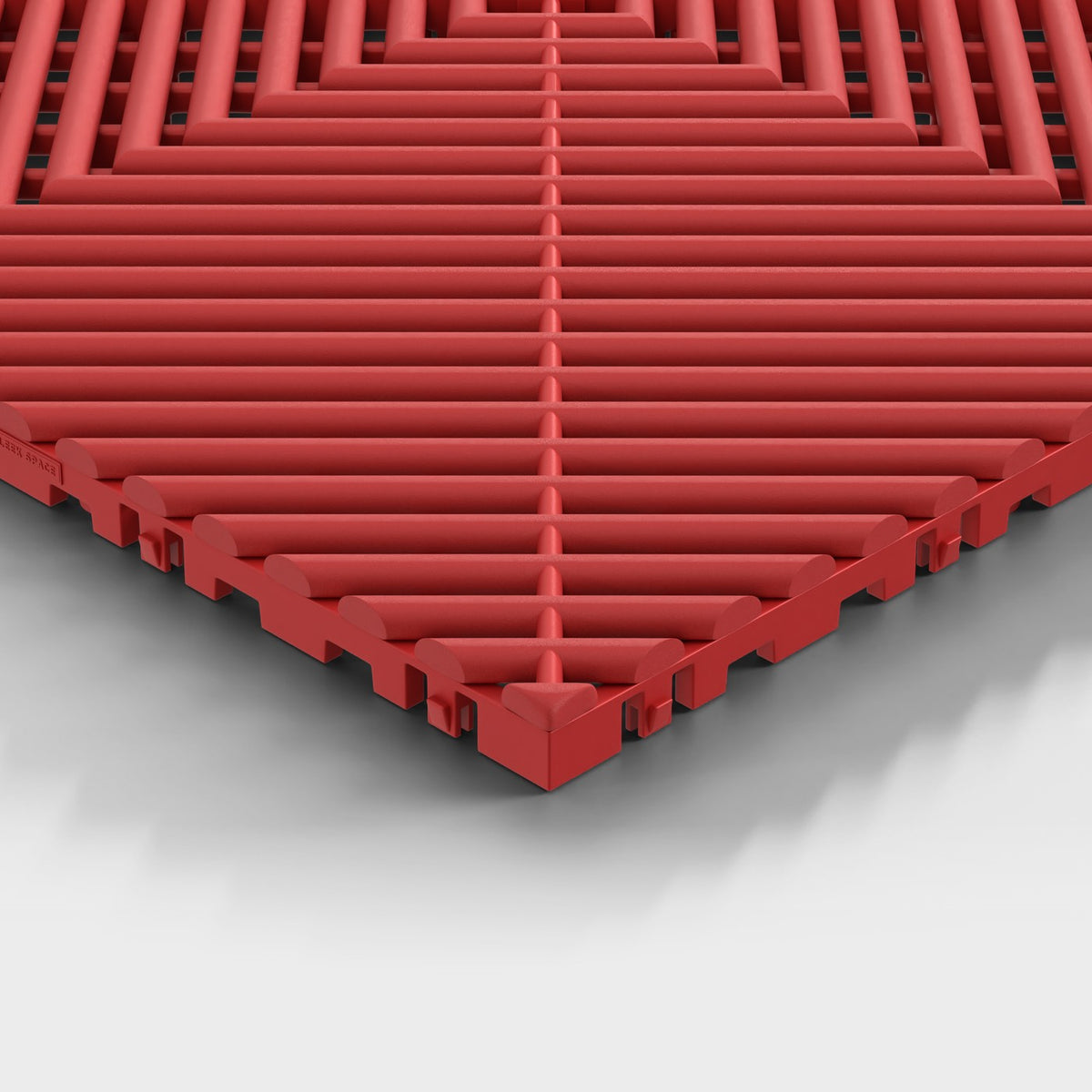ULTRAGRID tile in Crimson Red: one corner seen low, the open ribs and the legs under them