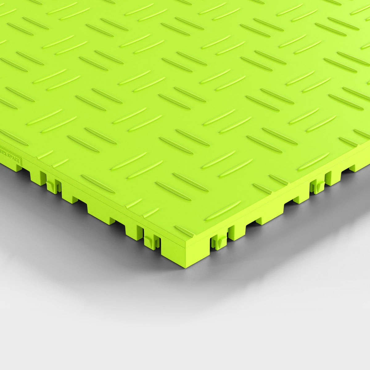 ULTRATUFF tile in Electric Green: one corner seen low and close