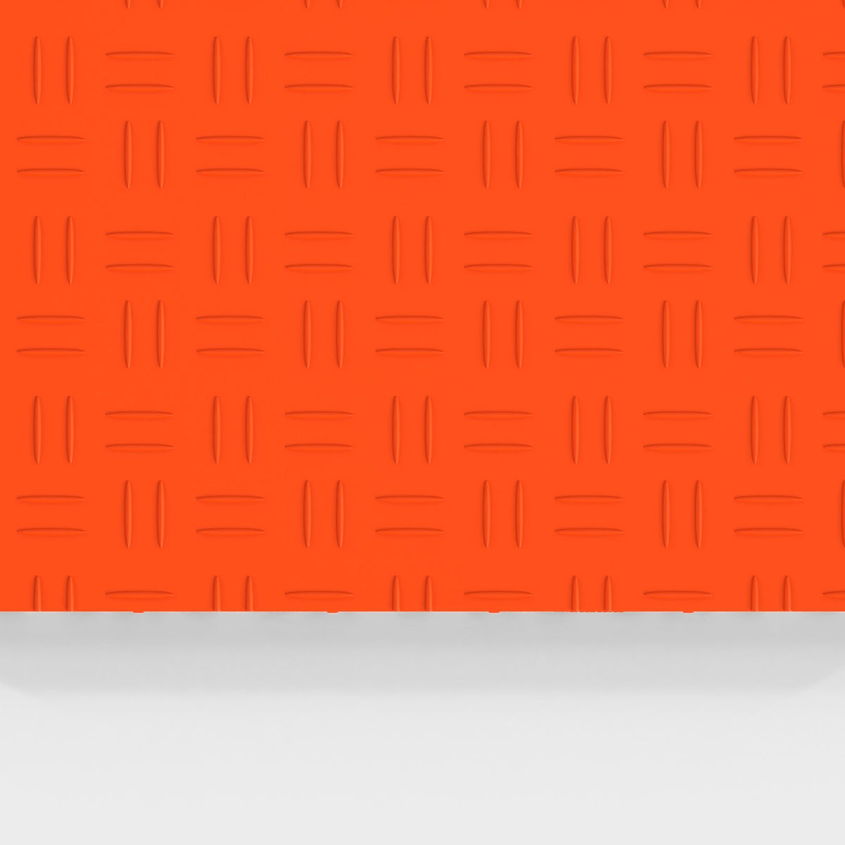 ULTRATUFF tile in Lava Orange: the diamond-tread face from above