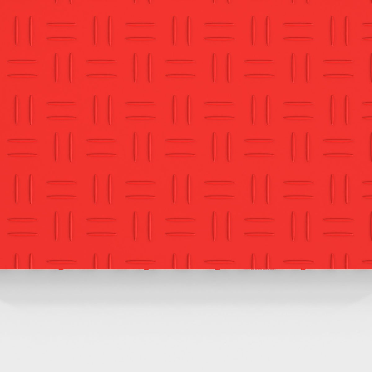 ULTRATUFF tile in Rosso Red: the diamond-tread face from above