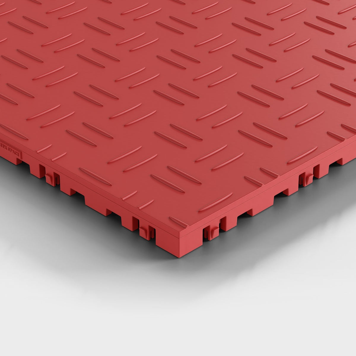 ULTRATUFF tile in Crimson Red: one corner seen low and close