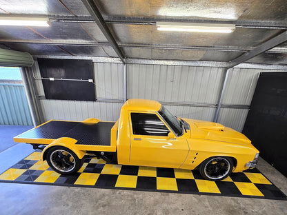 A customer's garage floor in ULTRAGRID Jet Black and Speed Yellow