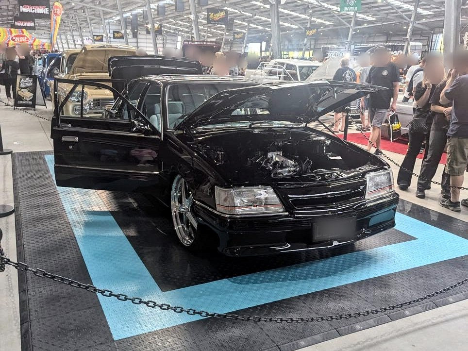 A customer's garage floor in ULTRATUFF Jet Black and Turbo Teal