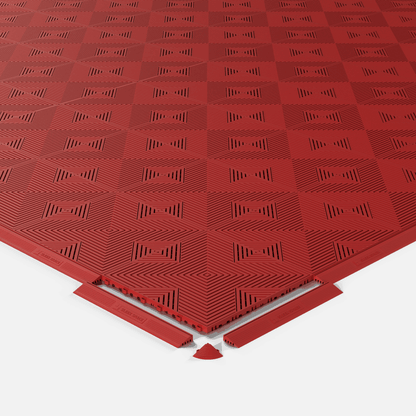 ULTRACORE garage floor tile in Crimson Red, shown with an edge ramp