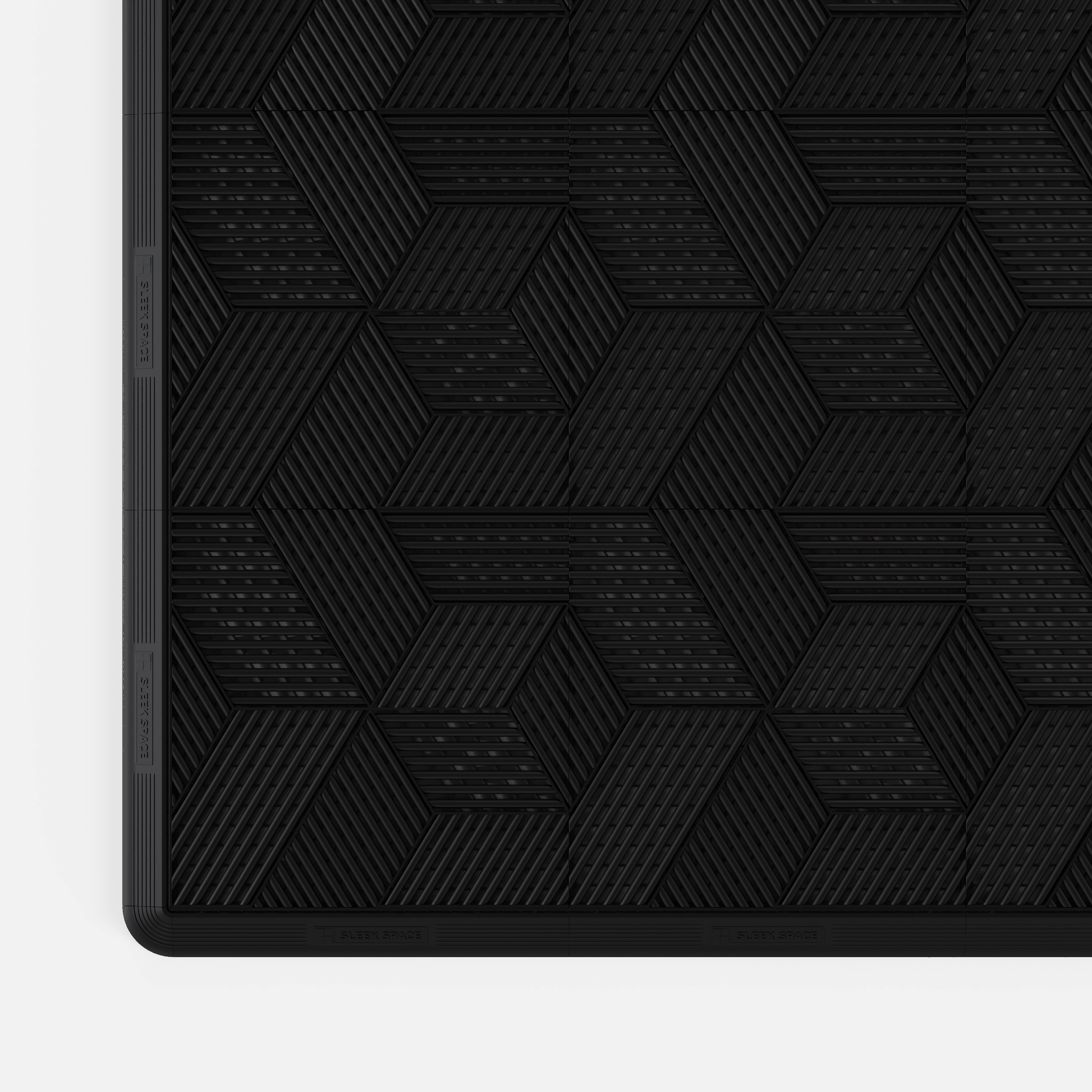 ULTRACUBE garage floor tile in Jet Black, with an edge ramp fitted