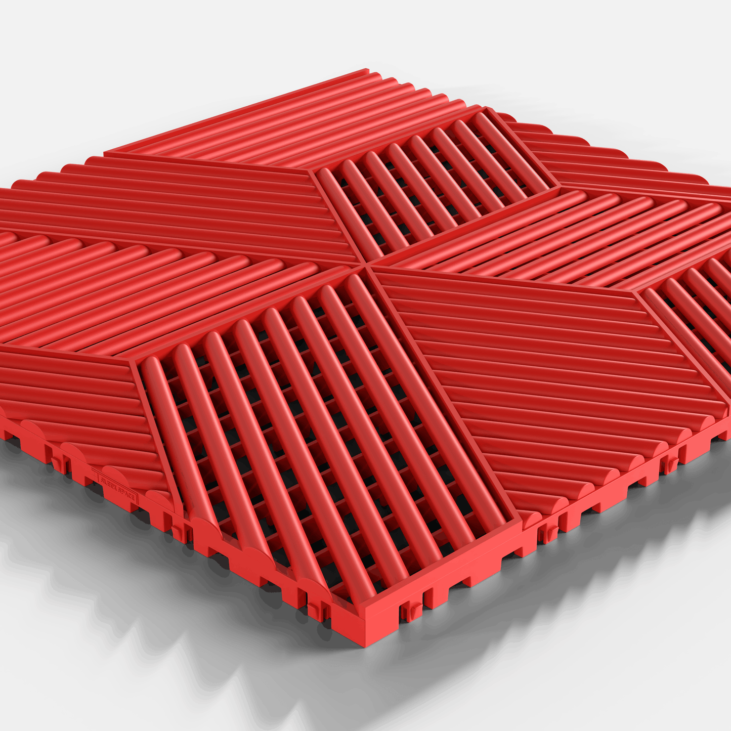ULTRACUBE garage floor tile in Rosso Red, single tile seen from a low angle
