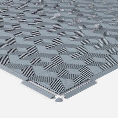 ULTRACUBE garage floor tile in Silver Grey, shown with an edge ramp