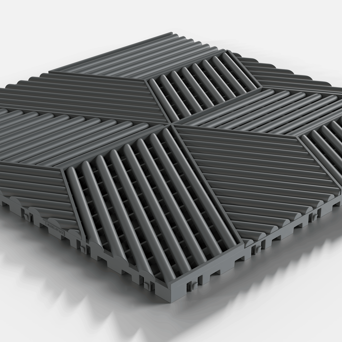 ULTRACUBE garage floor tile in Space Grey, single tile seen from a low angle