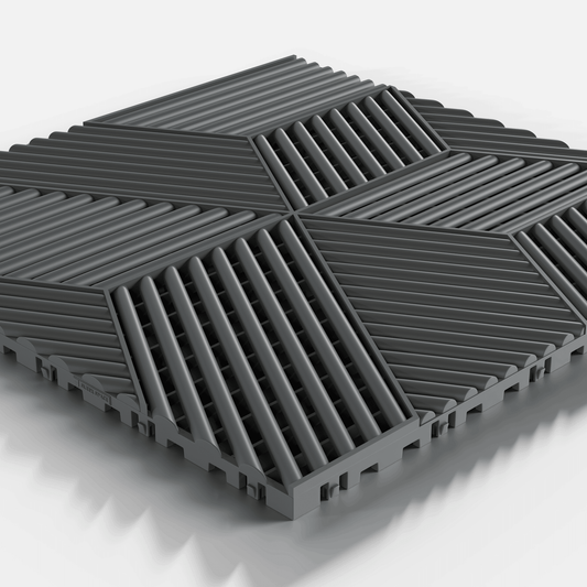 ULTRACUBE garage floor tile in Space Grey, single tile seen from a low angle