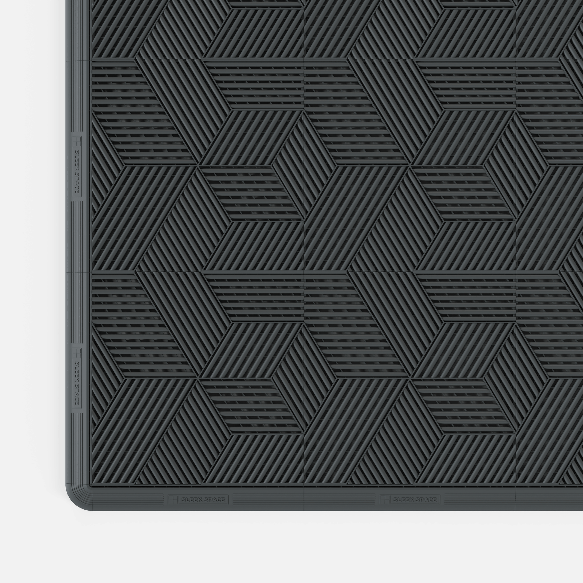 ULTRACUBE garage floor tile in Space Grey, with an edge ramp fitted