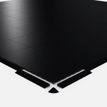 ULTRADECO modular floor tile in Onyx Black, shown with an edge ramp