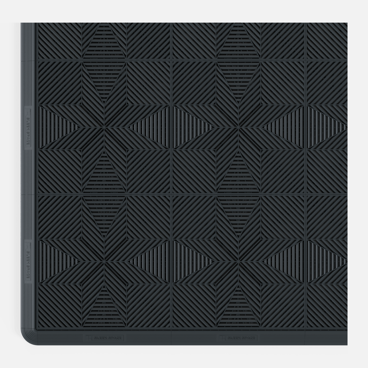 ULTRAFLUX garage floor tile in Stealth Grey, with an edge ramp fitted