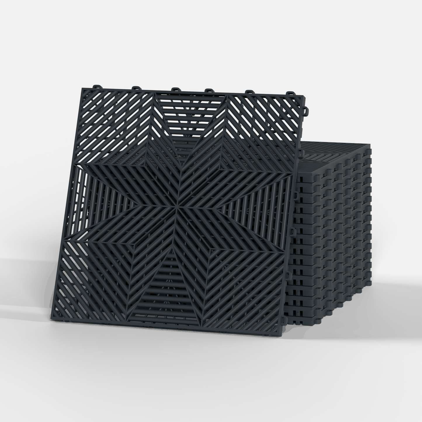 ULTRAFLUX garage floor tile in Stealth Grey, a stack of tiles