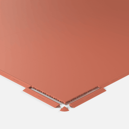 ULTRATONE modular floor tile in Outback Red, shown with an edge ramp