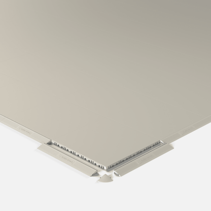 ULTRATONE modular floor tile in Pebble Beige, shown with an edge ramp