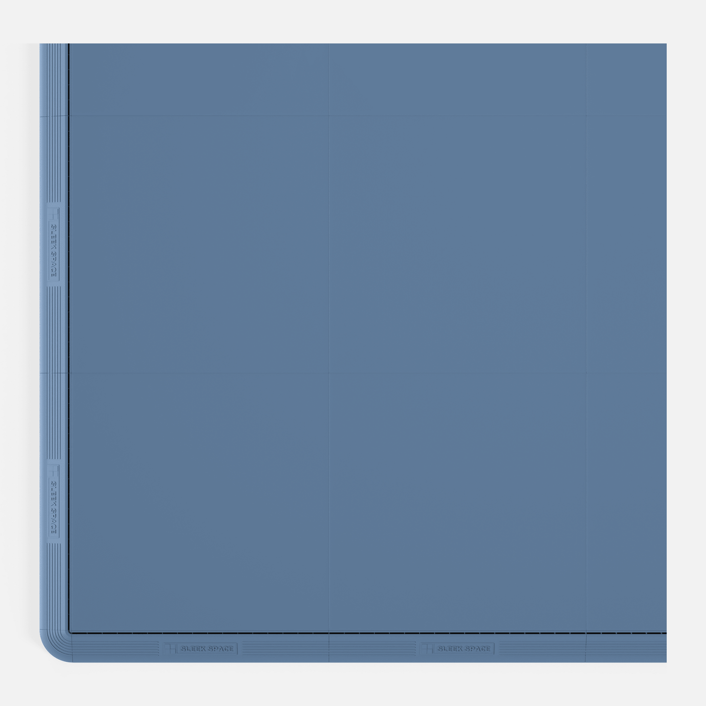 ULTRATONE modular floor tile in Steel Blue, with an edge ramp fitted