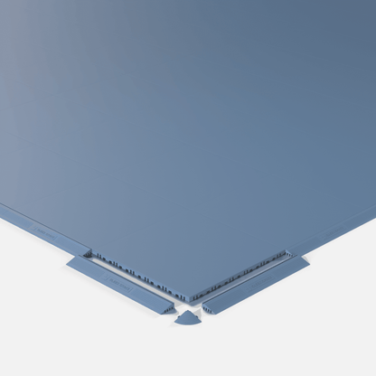 ULTRATONE modular floor tile in Steel Blue, shown with an edge ramp